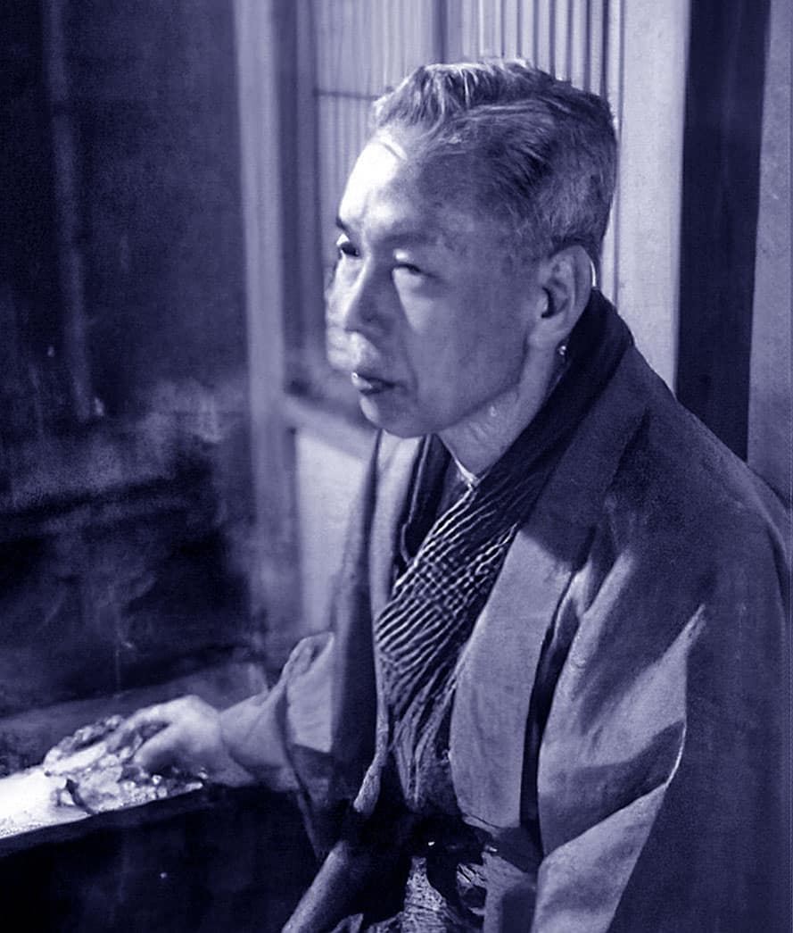 Portrait of Toyosaku Inoue, founder of hairdressing scissor manufacturer with a duotone effect which has a blue cast